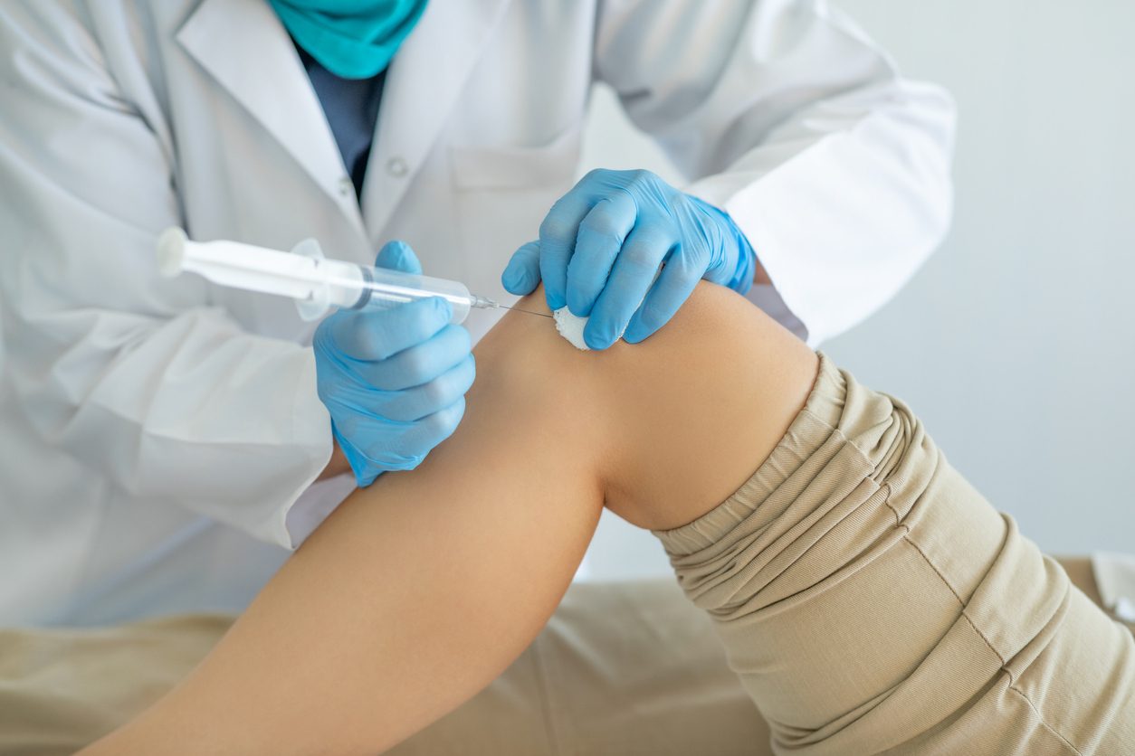 Patient receives viscosupplementation injection in knee